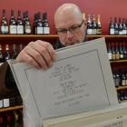 Darren Stedman sorts vinyl in Castle MacAdam Wine before today's record fair. Photo by Gerard O...