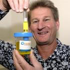 David Darling demonstrates one of the  Pacific Edge bladder cancer testing kits. Photo by Gregor...