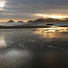 Dawn on Codfish Island beach with the Ruggedy Mountains of Stewart Island in the distance. Photos...