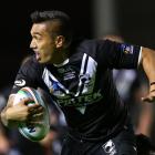 Dean Whare of New Zealand is tackled by Anthony Milford of Samoa during the Rugby League World...