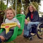 Debbie Henderson, who broke her back in a horse-racing accident, and 10-month-old son Will at...