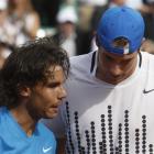 Defending champion, Rafael Nadal, left, of Spain congratulates John Isner, of the US, after their...
