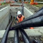 Delta civil construction worker Julian Corkill installs cables under Portsmouth Dr. Photo by...
