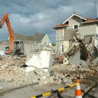 Contractors demolish a building on Highgate this week to make way for a $1.2 million restaurant....