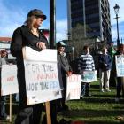 Demonstrators listen to speakers in the Octagon on Saturday at a protest against Rodney Hide's...