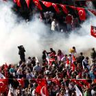 Demonstrators run as police use tear gas to disperse them in central Ankara, Turkey. REUTERS/Umit...