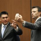 Deputy District Attorney. David Walgren, holding a bottle of propofol, questions Alberto Alvarez,...