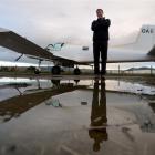 Des Neill, of Otago Airspread, with his Cresco aircraft which has recently been converted to an...