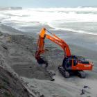 A digger moves sand on St Clair beach, Dunedin, yesterday. Photo by Peter Mcintosh.