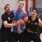 Dillon Boucher, Rick Rickert and Oscar Forman watch the ball during a New Zealand Breakers NBL...
