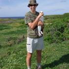 Doc Te Anau programme manager, biodiversity, Lindsay Wilson holds a laysan albatross in the...