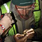 Doc Wakatipu bio-assets manager Barry Lawrence checks the gender of a long-tailed bat. Photo by...
