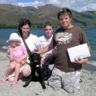 Dog rescuer Gus Evans (right), of Wanaka, is reunited with Billie the dog.  With them are, from...