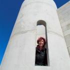 Dot Smith peeks out of her Oamaru stone castle, being built at Hilderthorpe, near Oamaru. Photo...