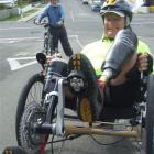 Double amputee John Nelson (front) is cycling around New Zealand, raising money and awareness for...