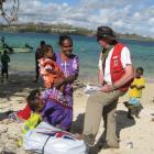 Douglas Clark distributes aid in Vanuatu following Cyclone Pam. Photos supplied.