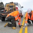 Downer line marking technician Anthony McKenzie and hybrid maintenance supervisor Shane Wilde...