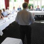 Dr Brian Rhoades  addresses the 22 graduates attending the Institute of Directors' Regional...