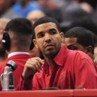 Drake watches the Toronto Raptors play against the Los Angeles Clippers in an NBA game at Staples...