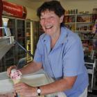 Marilyn Swinbourn rolls another ice cream during the  busy summer period. Photo by Gregor...