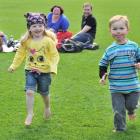 Dunedin 3-year-olds Erika Reilly and Martin Warriner race across the  Forsyth Barr Stadium pitch,...