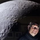 Dunedin amateur astronomer David Jaquiery casts an eye over a lunar image by Maurice Collins,...