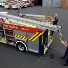 Dunedin Central Fire Brigade members (left to right) Senior Station Officer Dave Marsh and...