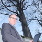Dunedin City Council landscape architect Barry Knox inspects a  lime tree  in  York Pl as part of...