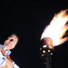 Dunedin City Council solid waste manager Ian Featherston by a methane flare, lit this week, that...