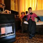 Dunedin City Council tenant Maryann Little tries to stave off the cold in her South Dunedin flat....