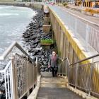 Dunedin City Council transportation operations manager Graeme Hamilton climbs one of the...