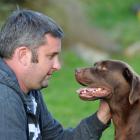 Dunedin dog breeder Simon Monson has a meeting of the minds  with his 5-year-old Labrador...