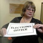 Dunedin electoral officer Pam Jordan checks the time, and closes the door of the elections office...