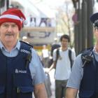 Dunedin emergency response commander Inspector Alastair Dickie (left) walks the beat through the...