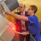 Dunedin Hospital senior radiation therapist Janine Ingham shows Health Minister Tony Ryall the...