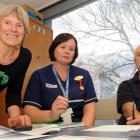 Dunedin Hospital staff handing over between shifts on Friday are (from left) duty office...