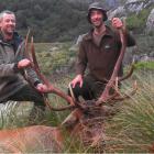 Dunedin hunters Dave Ford (left) and Trevor Bentley hold up the antlers of the wapiti  they...
