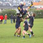 Dunedin lock Richard Thompson looses the support of his lifters while the Pirates forwards...