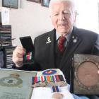 Dunedin man Neville Selwood can now add his Bomber Command clasp (in his right hand) to his other...