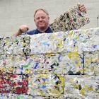 Dunedin man Peter Lewis shows off the bricks of recycled plastic made at the Green Island...