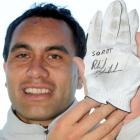 Dunedin man Phil Shaw scored seven stitches and this signed Phil Mickelson golf glove after being...