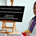 Dunedin Mayor Dave Cull unveils a plaque at the official opening of the building.