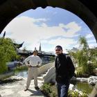 Dunedin Mayor Peter Chin (left) visits the Chinese Garden yesterday, with his replacement as...