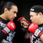 Dunedin mixed martial arts sparring partners Apii Taia (left) and Matt Toa eyeball each other....