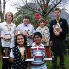 Dunedin NZ Modern School of Music pupils display the impressive haul of trophies they won at the...