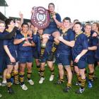 Dunedin players celebrate winning the 2009 Dunedin Premier rugby club title after beating...