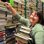 Dunedin Public Libraries marketing co-ordinator Kay Mercer holds stock set for the library's...