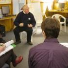 Dunedin resident Jan Clark (right) questions local body candidates (clockwise, from top) Cr...
