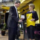 Dunedin resident Murray Schofield makes a donation to Maria Currie in the Octagon, Dunedin...