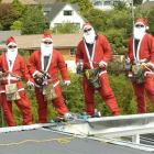 Dunedin roofers (from left) Luke Knight, Leon Cameron, Denny Knight and Daniel Cameron get into...